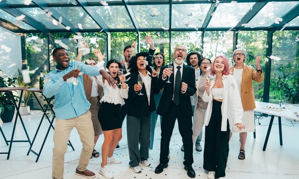 Businessmen and businesswomen making a corporate party after the business conference to celebrate the year goals and achievements.
